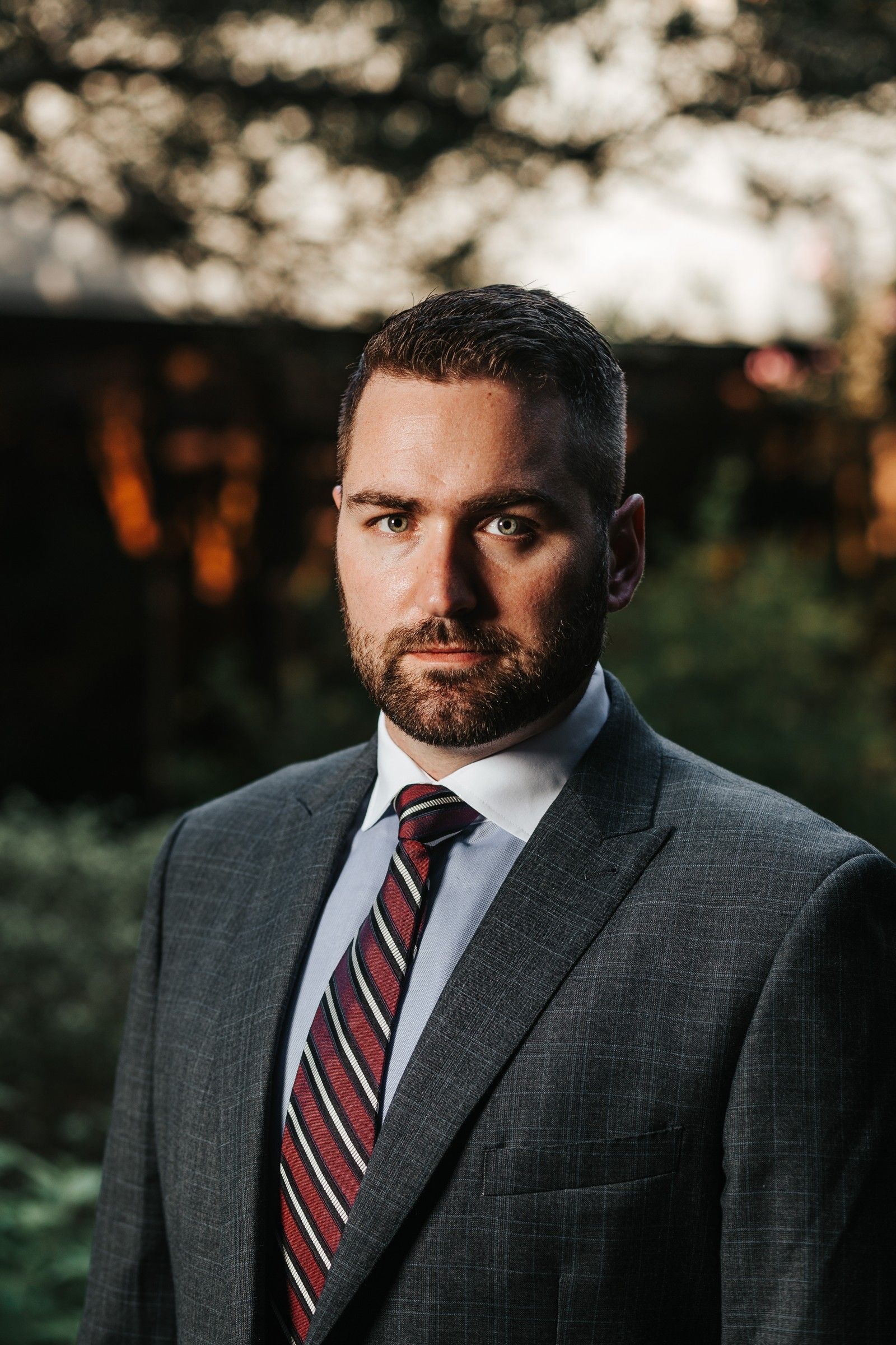 Brandon J. Grable, civil rights attorney in San Antonio, outdoor portrait with a serious expression